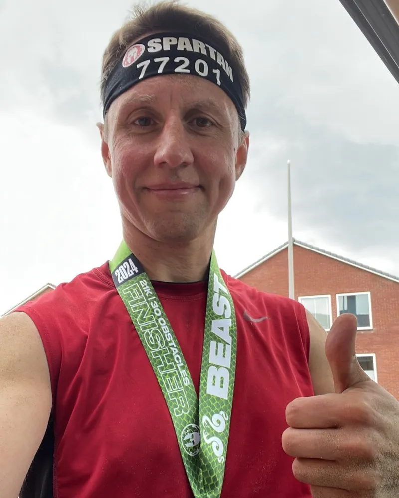 Alex with a Spartan Beast finisher medal